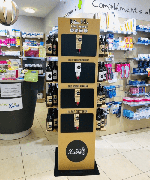 plv présentoir distributeur vrac en carton alvéolaire gel douche pharmacie
